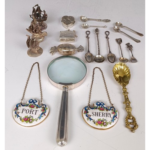 17 - A modern silver pill box, in the form of a sweet in a wrapper, assorted condiment spoons and other i... 