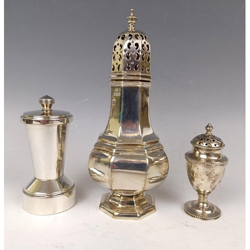 35 - A silver sugar caster, Sheffield 1923, a silver pepperette, 4.7 ozt, and a silver mounted peppermill... 