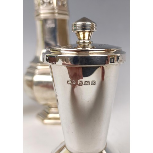 35 - A silver sugar caster, Sheffield 1923, a silver pepperette, 4.7 ozt, and a silver mounted peppermill... 