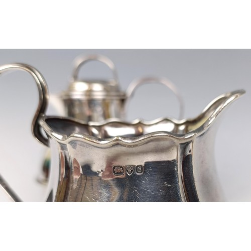 36 - A silver cream jug, in the form of a Guernsey milk jug, probably Birmingham 1905, and a silver cream... 