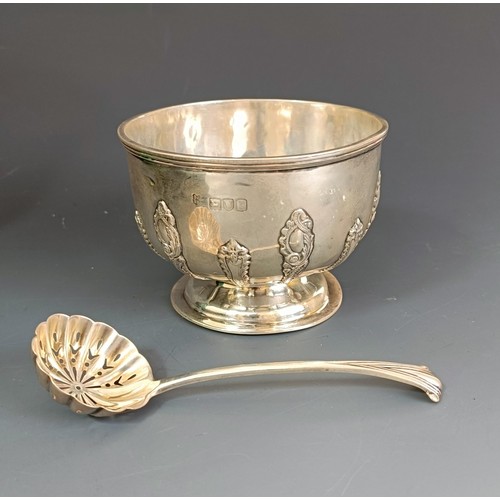 381 - A silver sugar bowl and a silver sifter spoon, London 1896/97, boxed