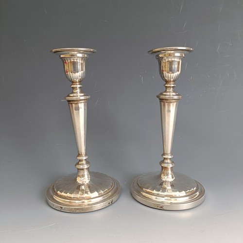 394 - A pair of George III style silver candlesticks, London 1963, 18.5 cm high