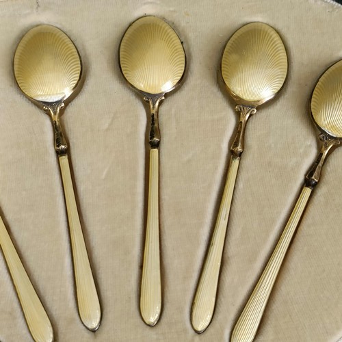 396 - A set of six silver gilt and yellow enamel teaspoons, boxed