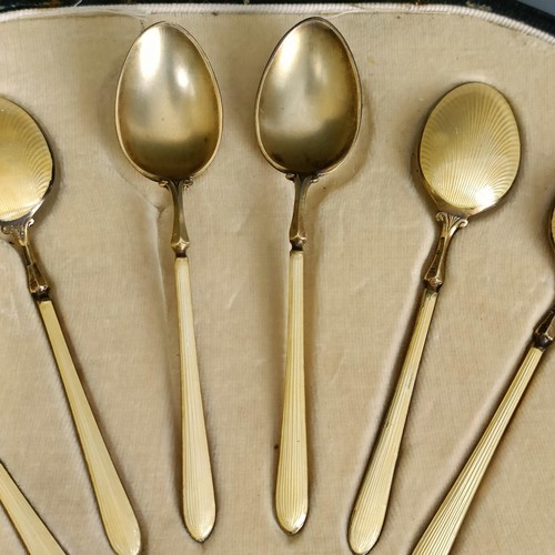 396 - A set of six silver gilt and yellow enamel teaspoons, boxed