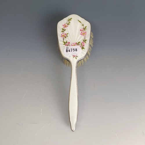 399 - A hairbrush, with floral enamel decoration