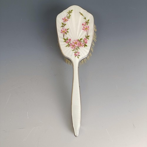 399 - A hairbrush, with floral enamel decoration