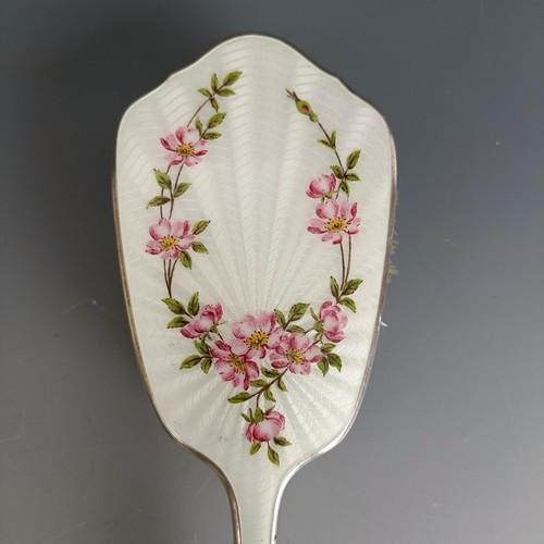 399 - A hairbrush, with floral enamel decoration