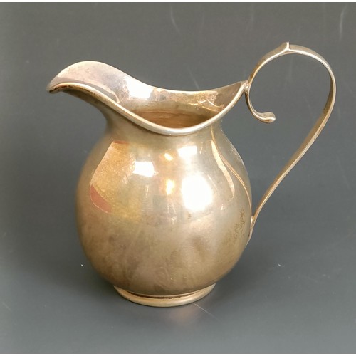 400 - A George V silver cream jug, 2.1 ozt, and a pierced silver vase, almost split into two pieces, base ... 