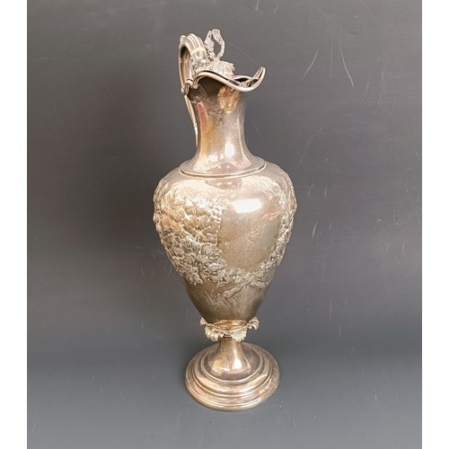 402 - A Victorian silver wine ewer, decorated flowers, with ivory spacers, Birmingham 1856, all in, 33.7 o... 