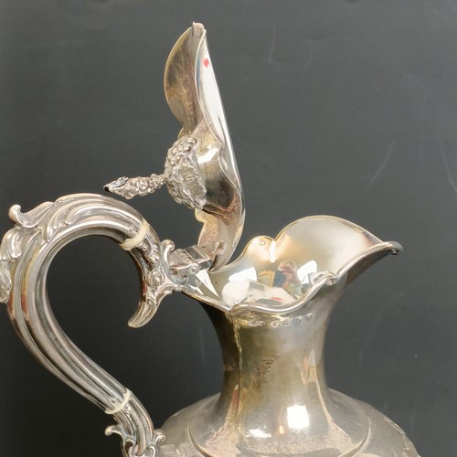 402 - A Victorian silver wine ewer, decorated flowers, with ivory spacers, Birmingham 1856, all in, 33.7 o... 