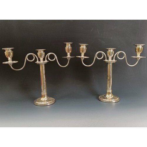 404 - A pair of Old Sheffield plate three light candelabra, crested, 32 cm high (2)