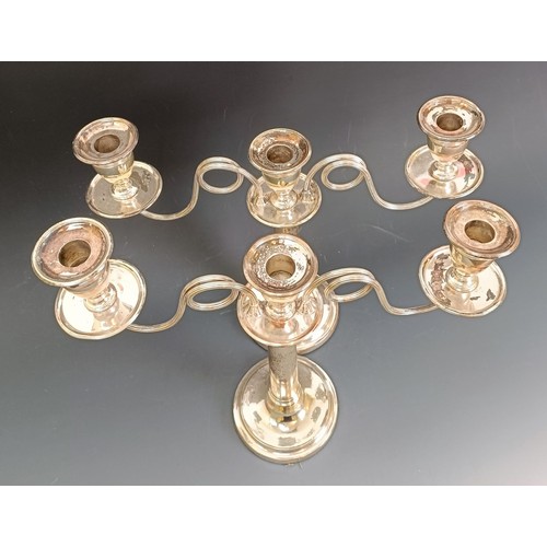 404 - A pair of Old Sheffield plate three light candelabra, crested, 32 cm high (2)