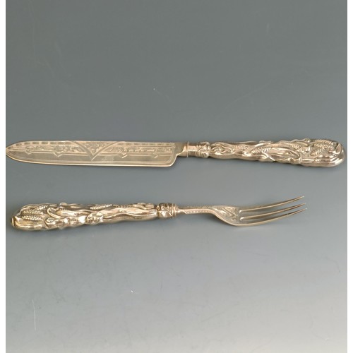 405 - A silver knife and fork set, the handles decorated bullrushes, Birmingham 1871, boxed