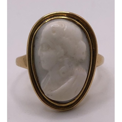 744 - A carved cameo ring, decorated a portrait, ring size G