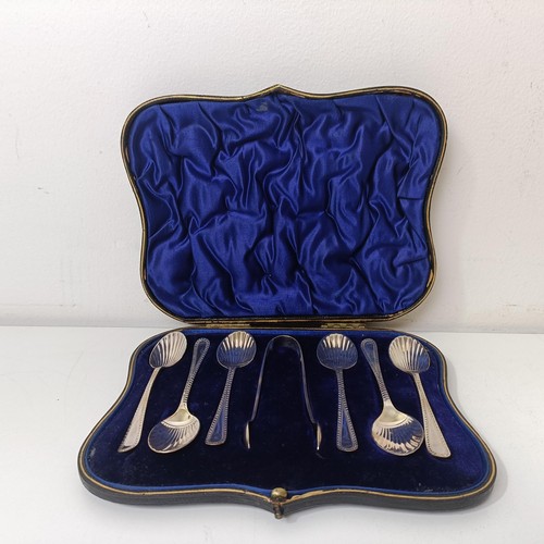 407 - A set of six silver teaspoons, with matching sugar tongs, a silver pickle fork, and a plated cake se... 