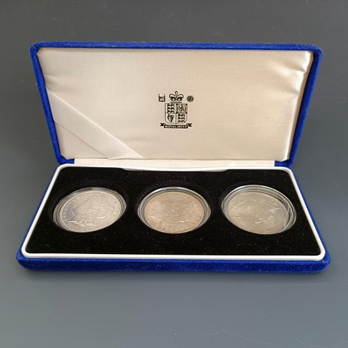 800 - Three American silver dollars, cased