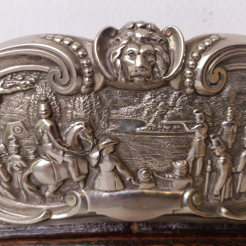 422 - An impressive Victorian silver plated and oak tray, the border decorated with battle scenes, the cen... 