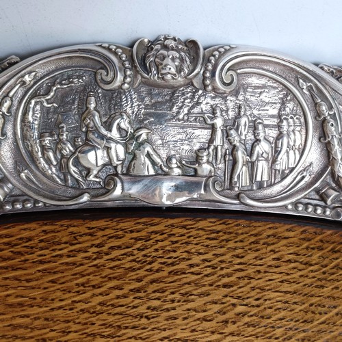 422 - An impressive Victorian silver plated and oak tray, the border decorated with battle scenes, the cen... 