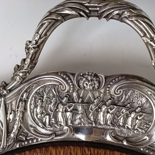 422 - An impressive Victorian silver plated and oak tray, the border decorated with battle scenes, the cen... 