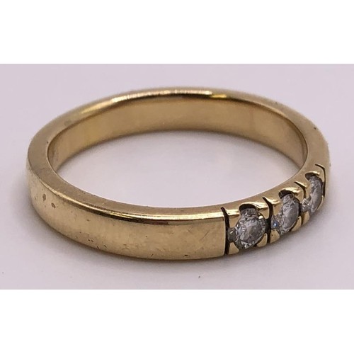 548 - A 9ct gold and three stone diamond ring, ring size T