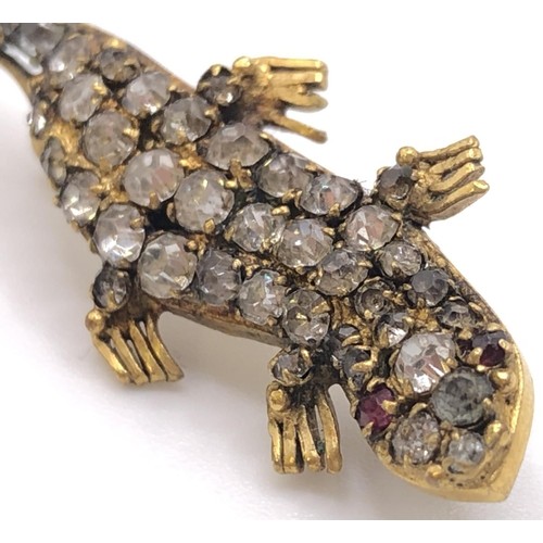 690 - An early 20th century paste set lizard brooch, in a vintage jewellery box