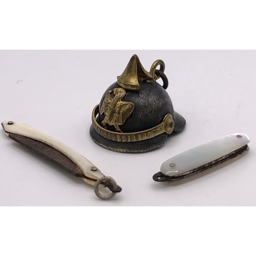 693 - A ruby glass and silver miniature perfume bottle, a silver pencil, an oval brooch, and assorted char... 