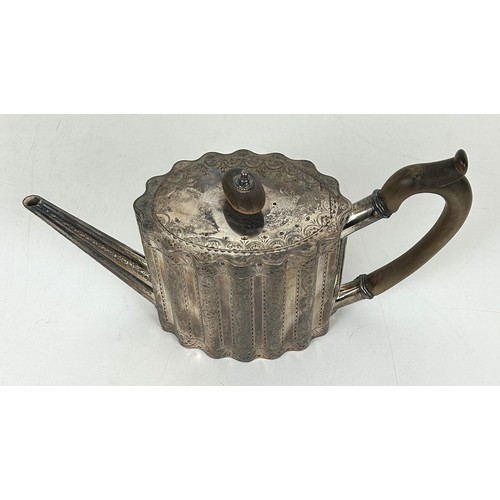 352 - An early 19th century silver teapot, of lobed oval form and with engraved decoration, London 1822, 1... 