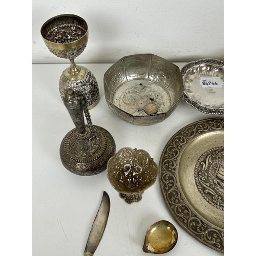 355 - A group of assorted silver coloured metal items, including spoons and bowls