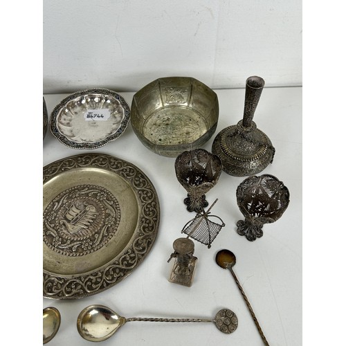 355 - A group of assorted silver coloured metal items, including spoons and bowls