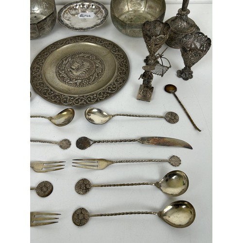 355 - A group of assorted silver coloured metal items, including spoons and bowls