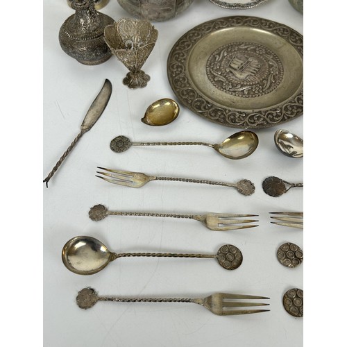 355 - A group of assorted silver coloured metal items, including spoons and bowls