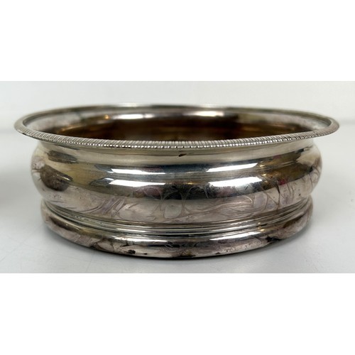 356 - A 17th century style silver bowl, initialed, London 1889, 2.9 ozt, and a silver mounted bottle coast... 