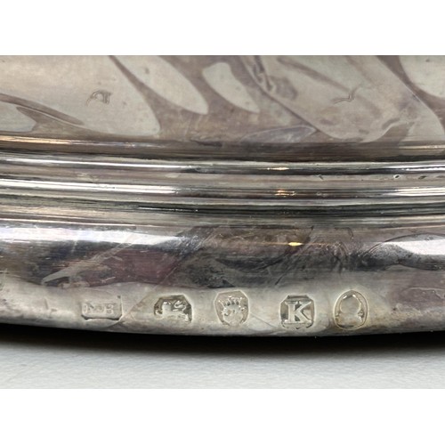 356 - A 17th century style silver bowl, initialed, London 1889, 2.9 ozt, and a silver mounted bottle coast... 