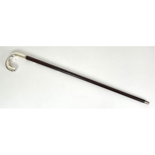 424 - A walking stick, with a silver coloured metal handle engraved 'Gustav Gustavason', 89 cm