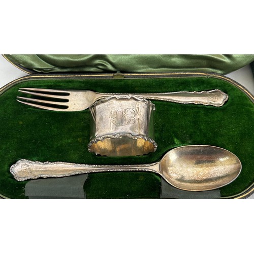 434 - A set of six Art Deco silver cake forks, cased, a fork, spoon and napkin ring, cased, a set of six A... 