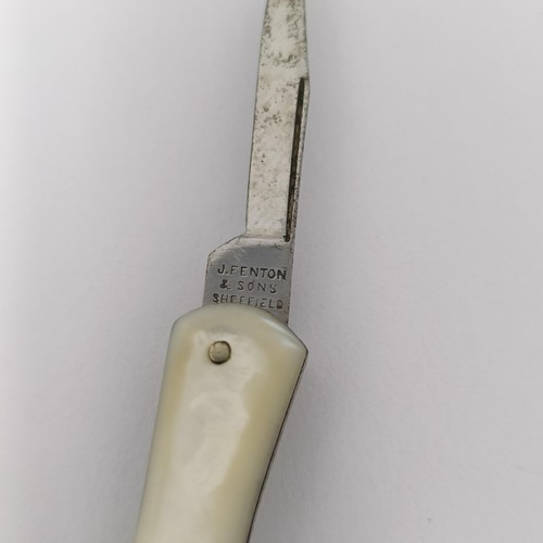 344 - A late 19th/early 20th century silver coloured metal novelty fruit knife, in the form of a lady's le... 