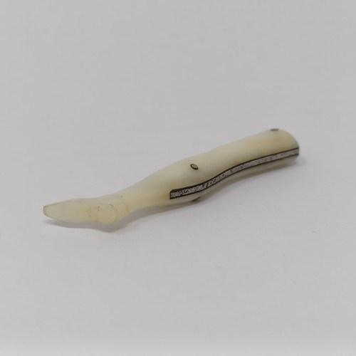 344 - A late 19th/early 20th century silver coloured metal novelty fruit knife, in the form of a lady's le... 