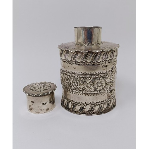 342 - A silver tea caddy, of circular form, monogrammed, crested and with embossed decoration, London 1896... 