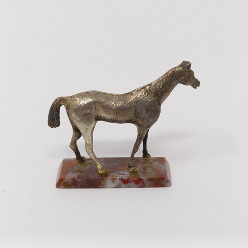 345 - A silver coloured metal figure of a horse, 4 cm wide, a pair of silver coloured metal figures of Dac... 