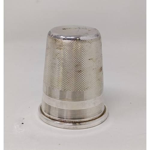 346 - A large silver thimble/measure, London 1977, assorted silver condiments and other items