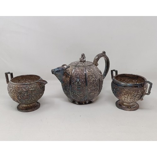 348 - A late 19th century Indian silver three piece tea service, the teapot of melon form, and having a sp... 