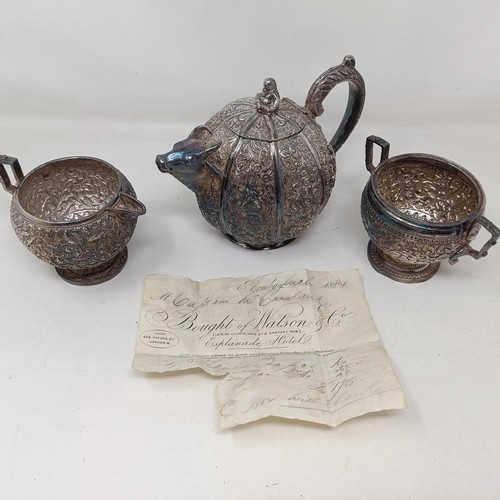 348 - A late 19th century Indian silver three piece tea service, the teapot of melon form, and having a sp... 