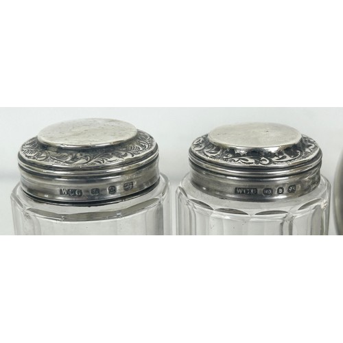 430 - A George IV silver capstan inkwell, another, two photograph frames, with silver mounts, and three si... 