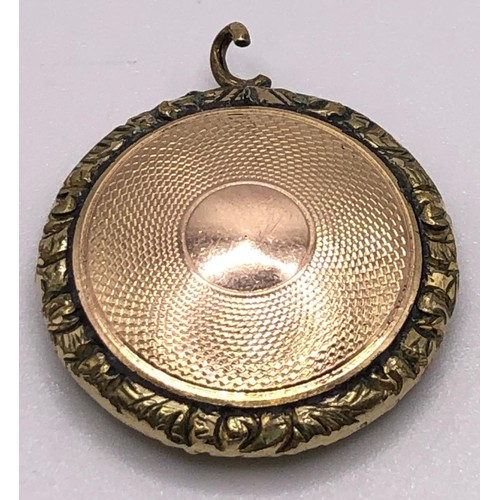 738 - A late 19th century yellow metal locket, inset with a lock of hair, a pair of yellow metal Lorgnette... 