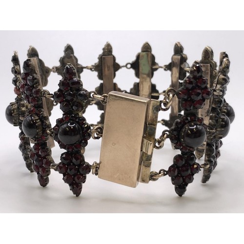 740 - A 19th yellow metal and garnet bracelet, in a vintage jewellery box