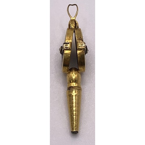 741 - A yellow metal, diamond and enamel watch key