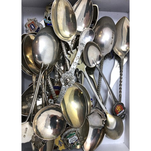 81 - Assorted silver coloured metal and other travel/commemorative spoons, some with enamel decoration