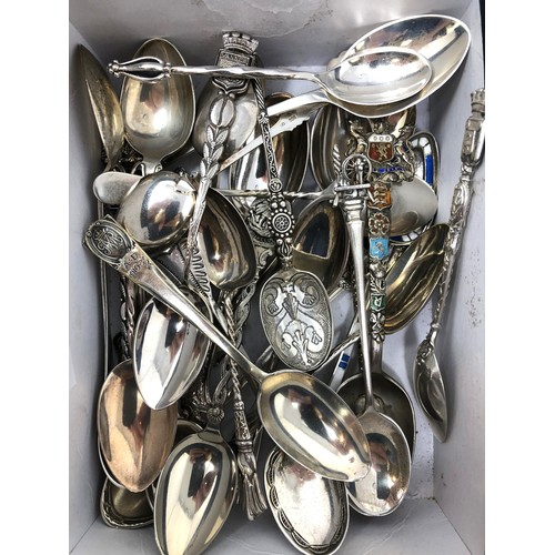 82 - Assorted silver coloured metal and other travel/commemorative spoons, some with enamel decoration