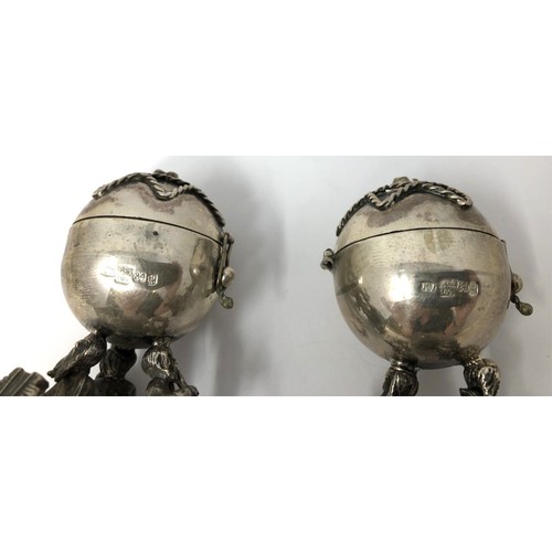 101 - Two late 19th century Russian silver pierced spheres, in figural supports, 84 standard, 1894, 8 cm h... 