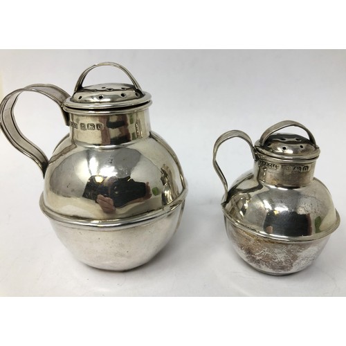 112 - A silver pepperette, in the form of a Guernsey jug, Birmingham 1938, 6.5 cm high, and another, 5 cm ... 